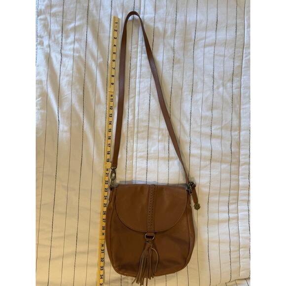 Lucky Brand | Ali Cognac Pebble Leather Flap Crossbody Saddle Bag Tan Tassel - Picture 12 of 12